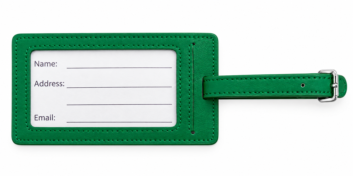 A green leather luggage tag with a white rectangular label for name, address, and email, featuring a matching green strap and silver buckle on a white background.