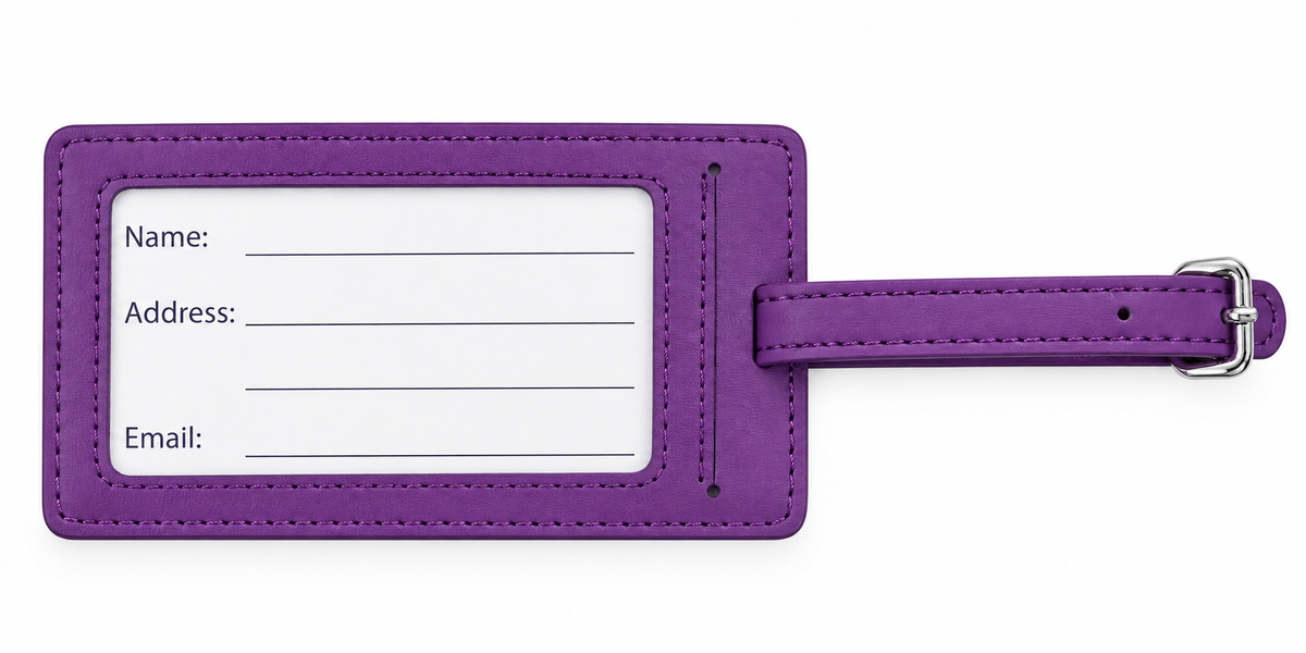 A purple faux leather luggage tag with a white insert card for name, address, and email, featuring a matching purple strap and silver buckle on a white background.