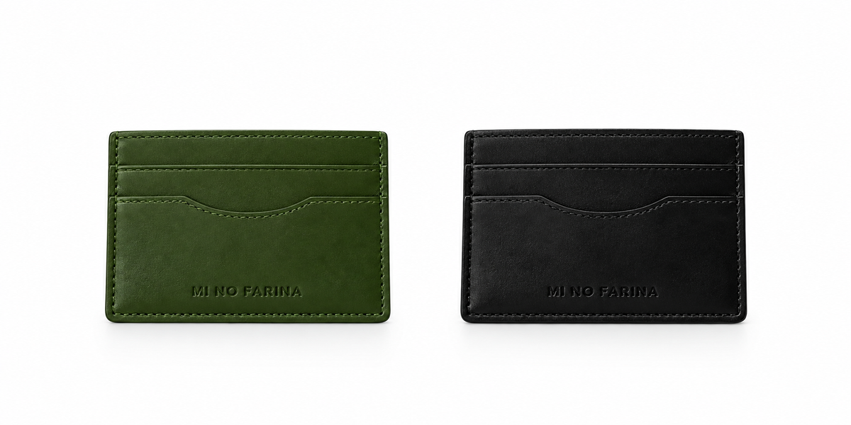 Two minimalist compact  card holders by Mi No Farina, one in olive green and one in black, displayed side-by-side on a clean white background.